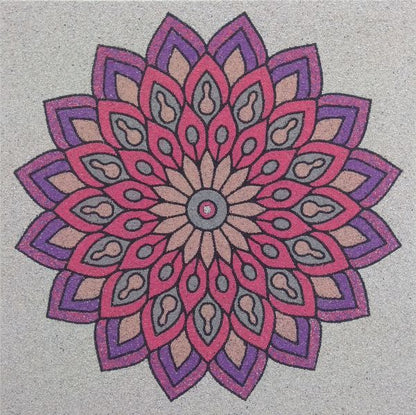 Mandala 1 homokkép with colorful, intricate design on a sandy background.